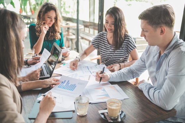 Diverse business team meeting in a coffee shop