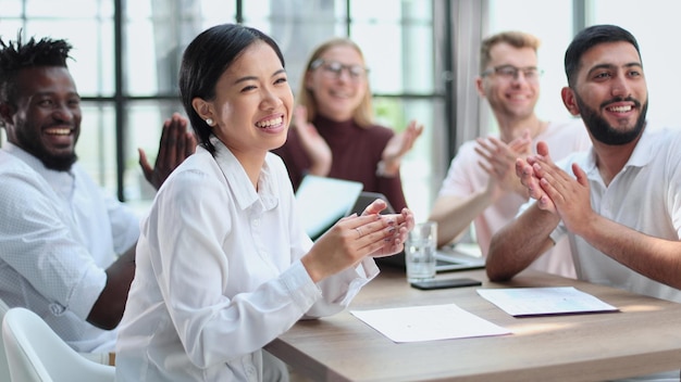 Diverse business team smiling to camera in office