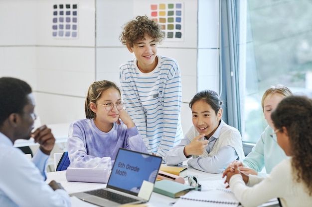 Diverse children smiling happily while enjoying group activity in math class