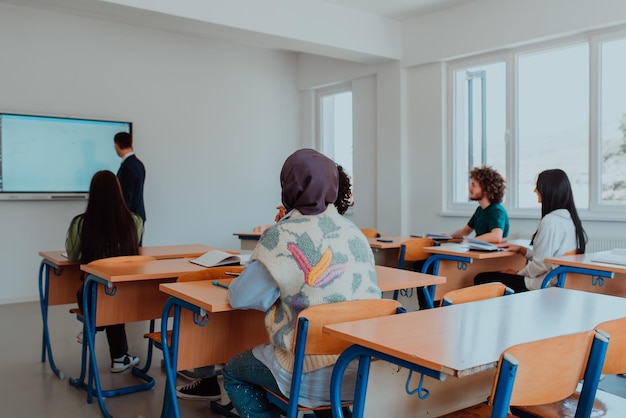 A diverse group of students is attentively listening actively participating and embracing modern edu