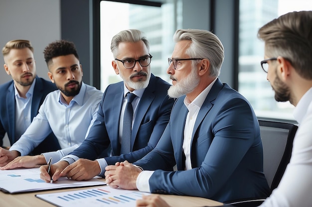 Diverse professional executive team working at meeting in office Mid aged business man manager leader talking to board people consulting partners investors discussing project management in teamwork