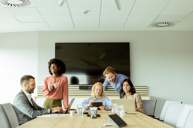 Diverse team engaging in collaborative efforts during a creative office meeting at midday