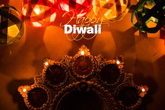 Diwali Greeting card showing illuminated Diya or Clay oil lamp or Panti with Happy Diwali text