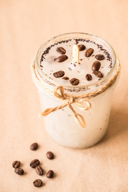 DIY concept handmade scented candle with coffee beans in a glass jar