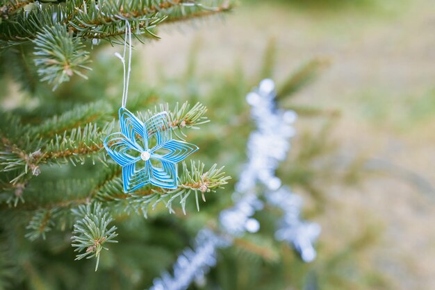 DIY handmade paper decoration on Christmas tree