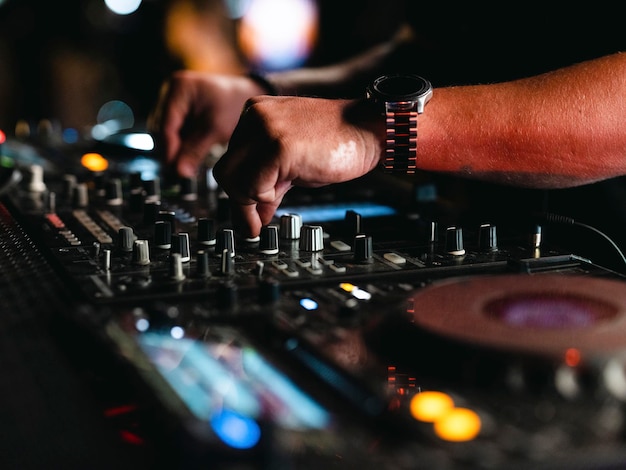 A dj playing music in a nightclub