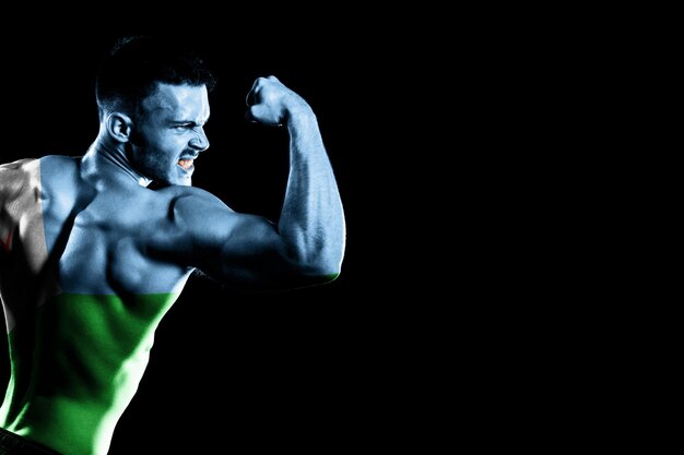 Djibouti flag on handsome young muscular man black background