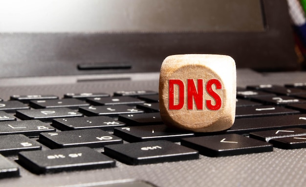 Photo dns acronym domain name system concept on cubes