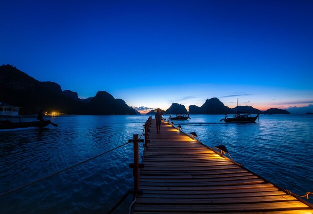 a dock with a boat in the background and a boat in the background