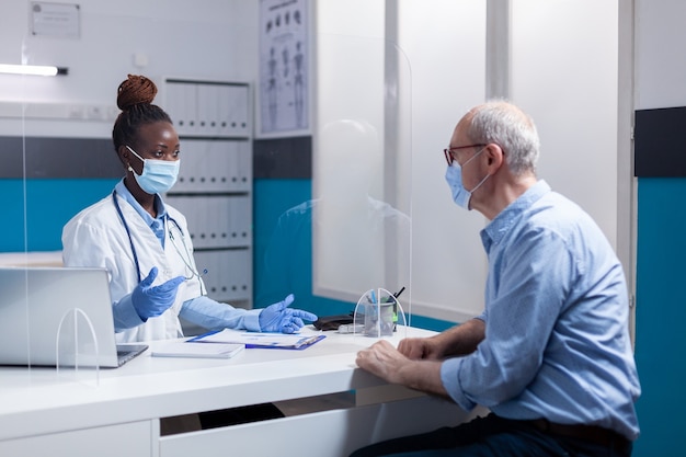 Doctor of african american ethnicity wearing face mask