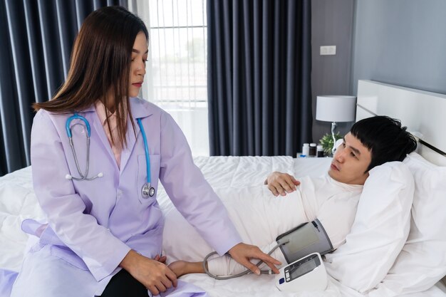 Doctor checking on the patient in a hospital room