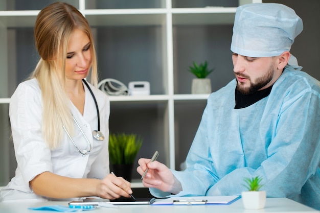 Doctor checks the health of the patient in the clinic