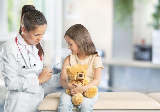 Doctor and child patient. Physician examines little boy by stethoscope.