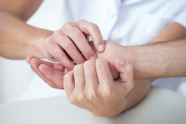 Doctor doing hand massage