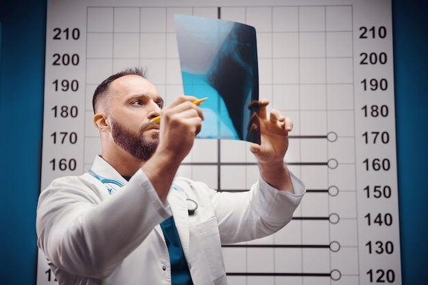 doctor examines the xray and mri in the office