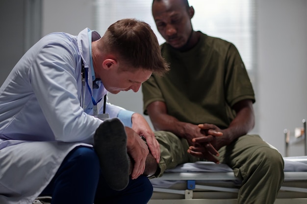 Doctor Examining Broken Leg