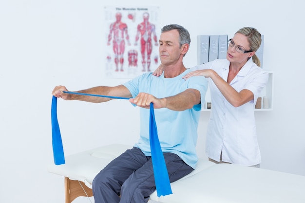 Doctor examining her patient back 