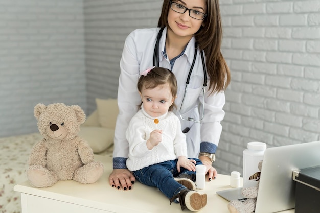 Doctor examining a little girl in a hospital