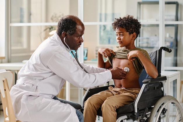 Doctor examining patient with disability