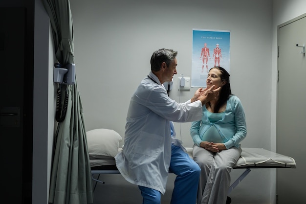 Doctor examining a pregnant woman in the hospital