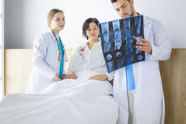 Doctor explaining diagnosis to her female patient