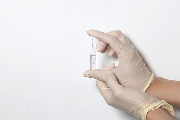 Doctor filling syringe with medication closeup Vaccination and immunization