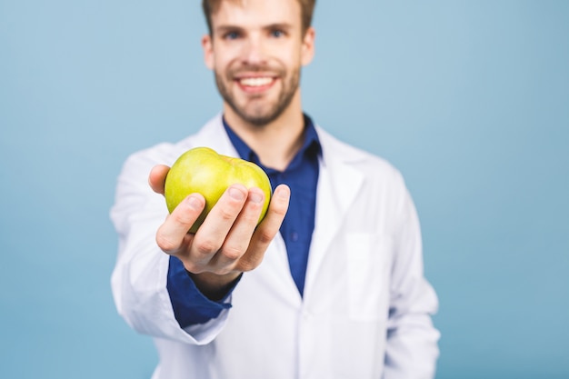 Doctor giving apple concept for healthy eating and lifestyle or good diet