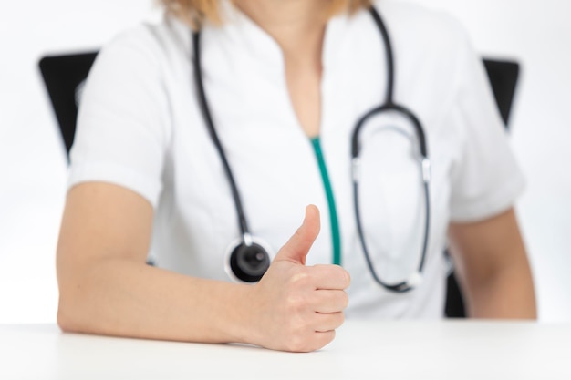 Doctor hand giving thumbs up, isolated on white background