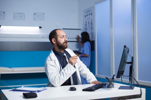 Doctor having a video call in office