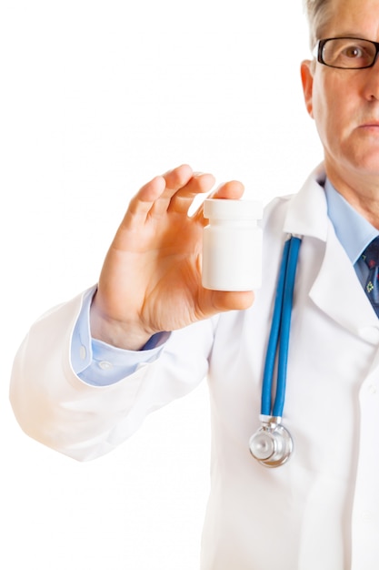 Doctor holding bottle with pills