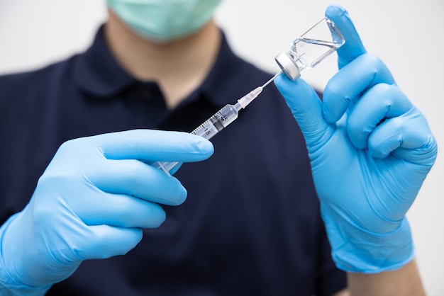 doctor holding coronavirus vaccine