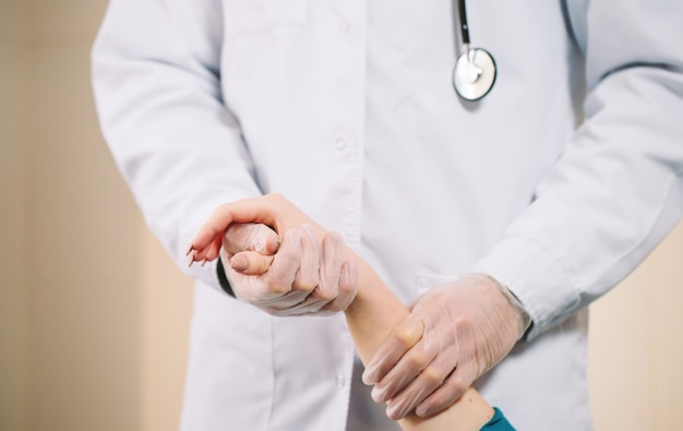 Doctor holding girl's hand