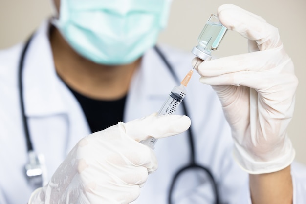 Doctor holding new covid-19 vaccine