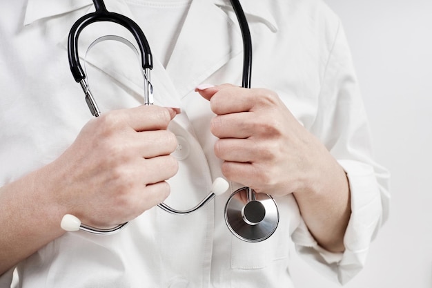 Doctor holding a phonendoscope or stethoscope in his hand