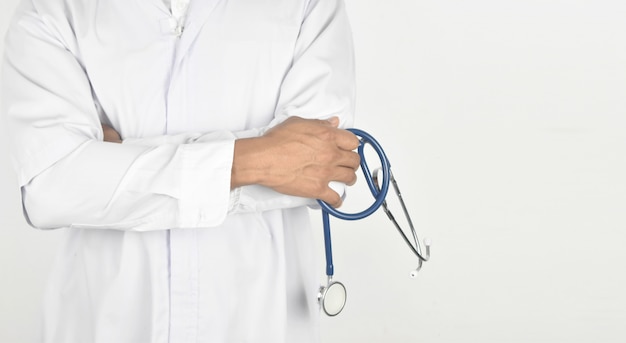 Doctor holding stethoscope in hands on white  with clipping path.