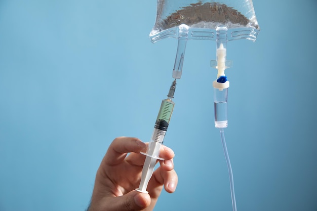 Doctor injection liquid drug to saline bag