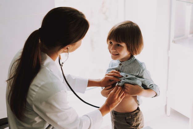 Doctor Listening to Kids Chest with Stethoscope