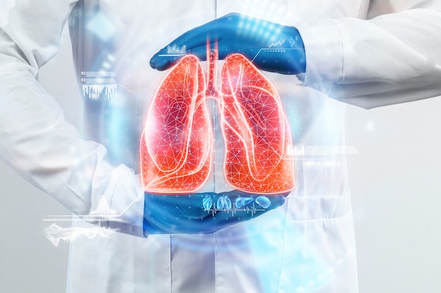 The doctor looks at the hologram of Lungs, checks the test result on the virtual interface and analyzes the data. Pneumonia, donation, innovative technologies, medicine of the future.