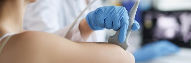 Doctor makes an ultrasound of the vessels of the hands