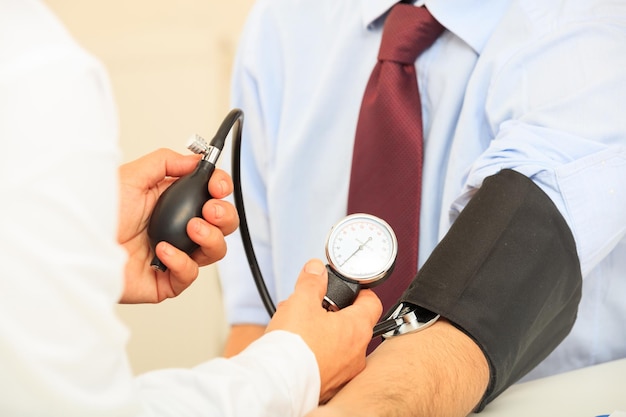 Doctor measuring blood pressure