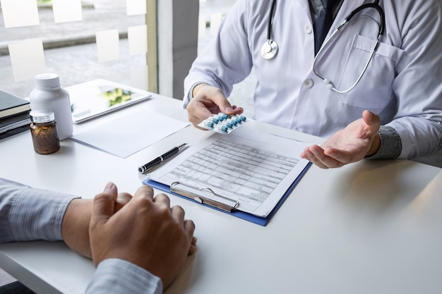 Doctor and patient are discussing consultation about symptom problem diagnosis of disease talk to the patient about medication and treatment method.