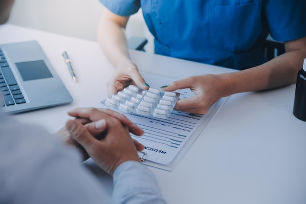 Doctor and patient are discussing consultation about symptom problem diagnosis of disease talk to the patient about medication and treatment method