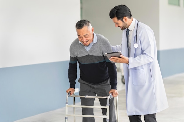 Doctor and patient in conversation recommend medical treatment on digital tablet