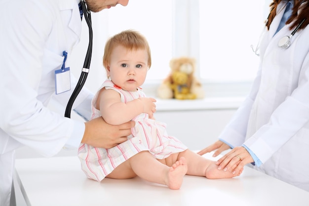 Doctor and patient Happy cute baby at health exam Medicine and health care concept