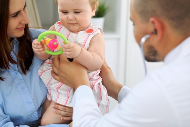 Doctor and patient Happy cute baby at health exam Medicine and health care concept