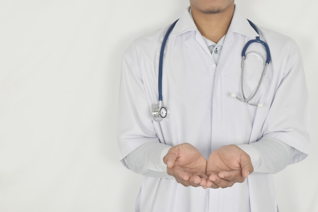 Doctor presenting blank hand on white background medical coverage insurance concept