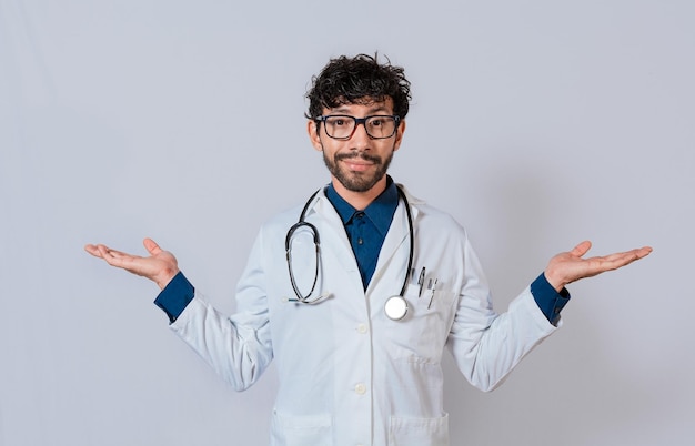 Doctor presenting something with both palms Young doctor with palms open to the sides Bearded doctor with both palms open