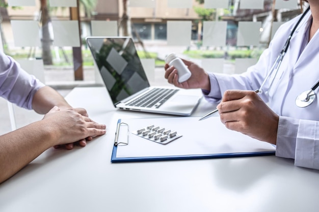 Doctor presenting with patient and checking results on report and prescription about the problem of illness and recommend using medicine, healthcare and medical concept.