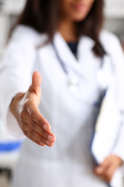 Doctor shake hand as hello with patient