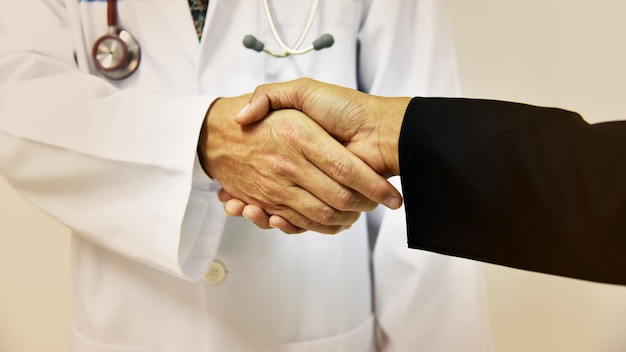 Doctor shaking a patient's hands